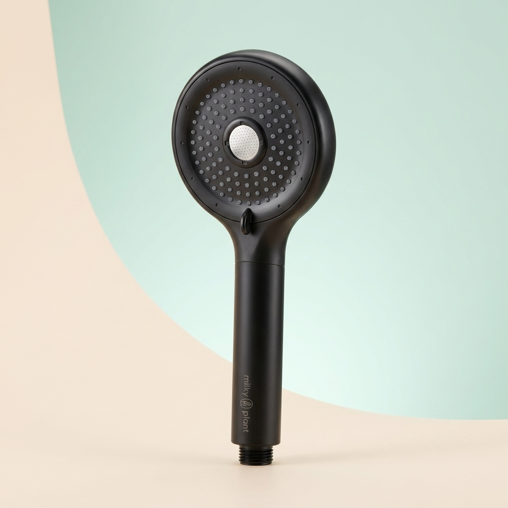 The ShowerT filtered handheld showerhead in matte black, upright three-quarter angle